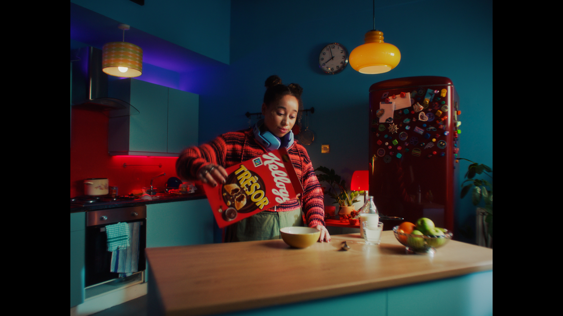 Girl pouring kelloggs krave into bowl