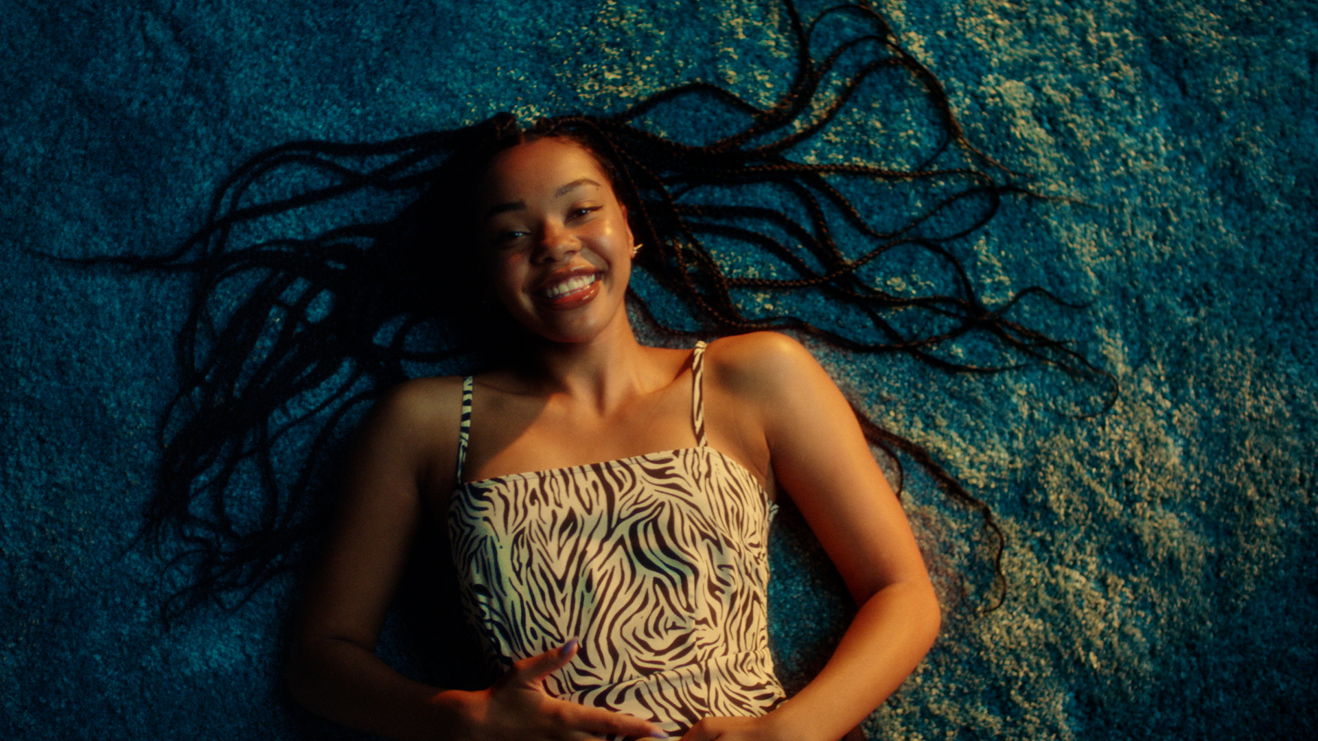 Girl lying on floor smiling