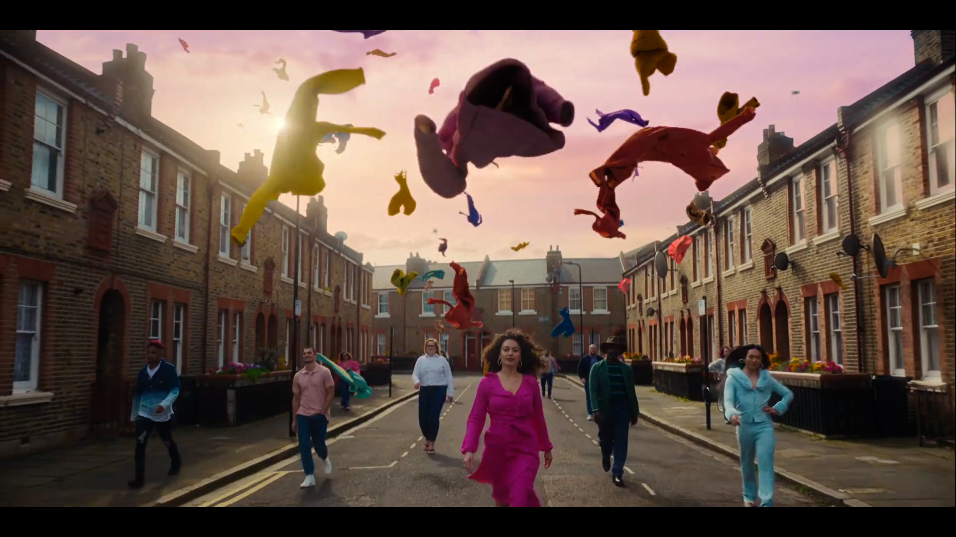 Woman walking down street with group following
